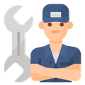 A mechanic with his arms crossed is standing next to a wrench.