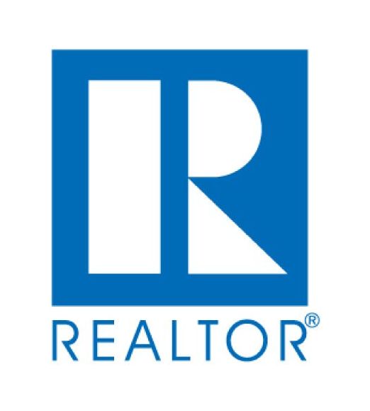 A blue and white realtor logo on a white background
