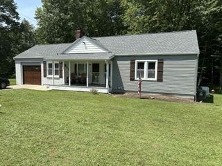 House with Blue Siding and Brick Chimney — Kent, OH — ARC Contracting of Ohio LLC