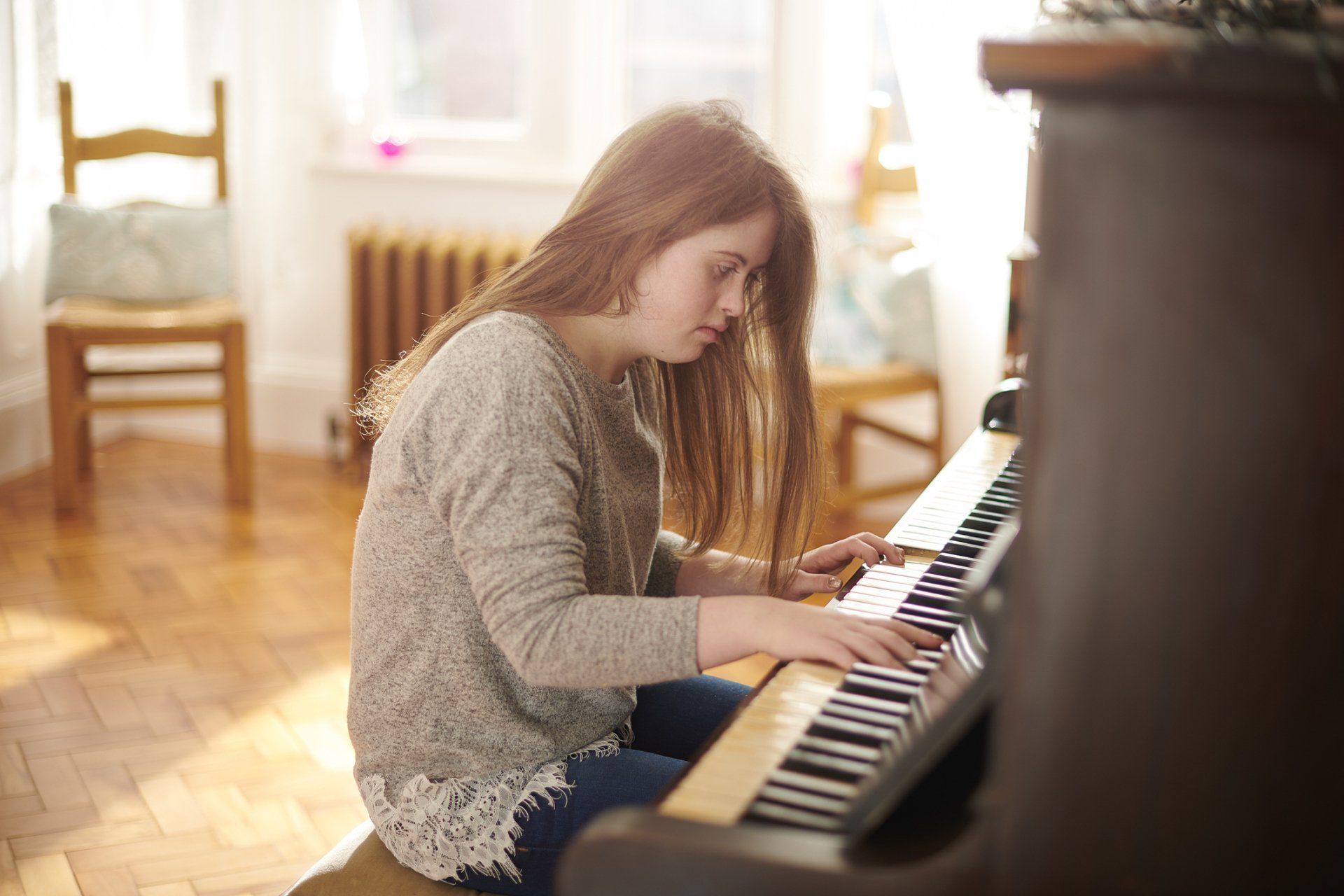 Teenager Playing the Piano at Home – Philadelphia, PA – Law Office of Mark W. Voigt