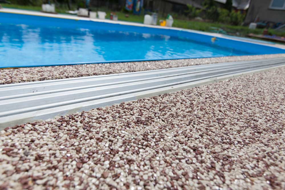 Exposed Aggregate Around The Pool — McCoy Concreting in Westbrook, QLD