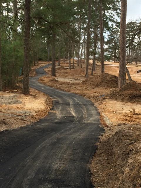 Asphalt Laid On A n Excavated Road — Houston, TX — HEV Asphalt Paving Co.