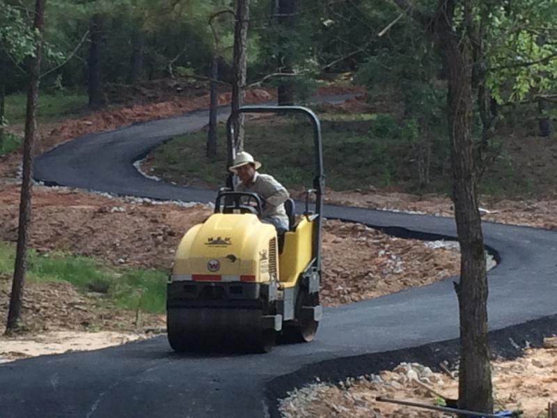 Paving The Asphalt Road — Houston, TX — HEV Asphalt Paving Co.