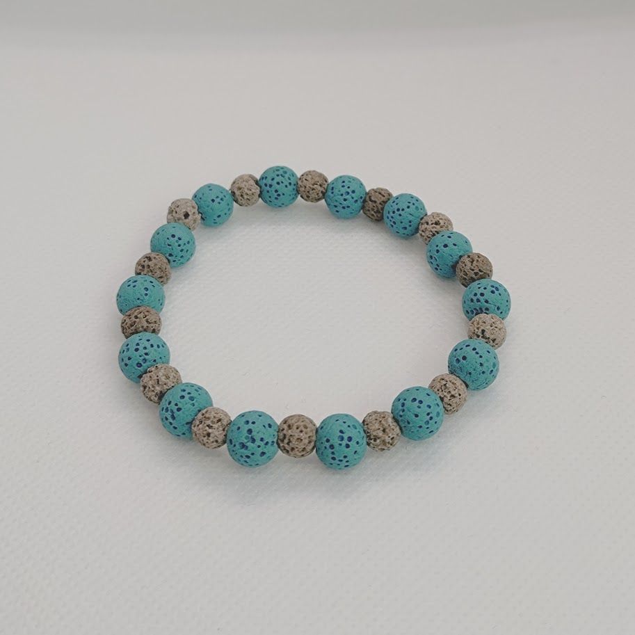 Mooie armband van lavasteenkralen in de kleuren blauw en grijs. Geschikt voor aromatherapie.