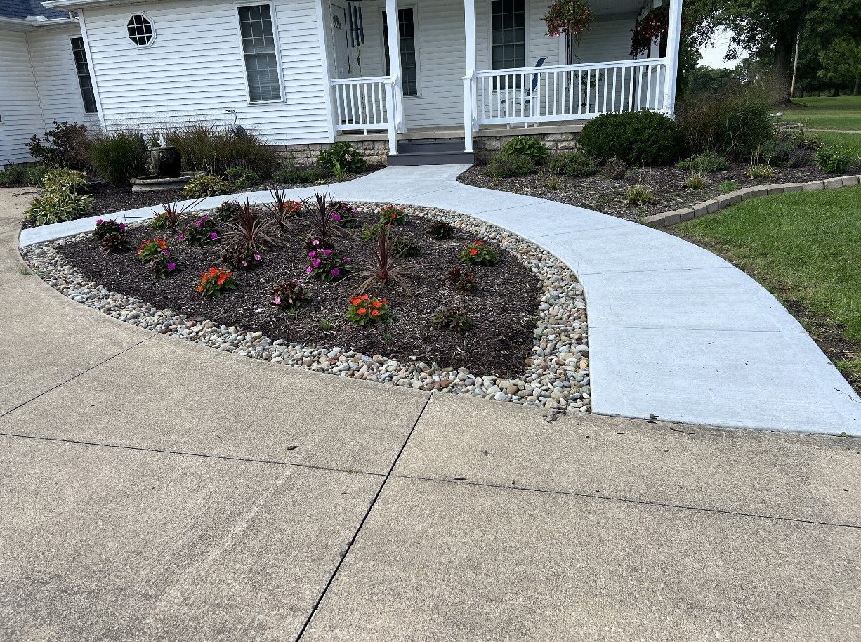 circular concrete sidewalk with landscaping bed