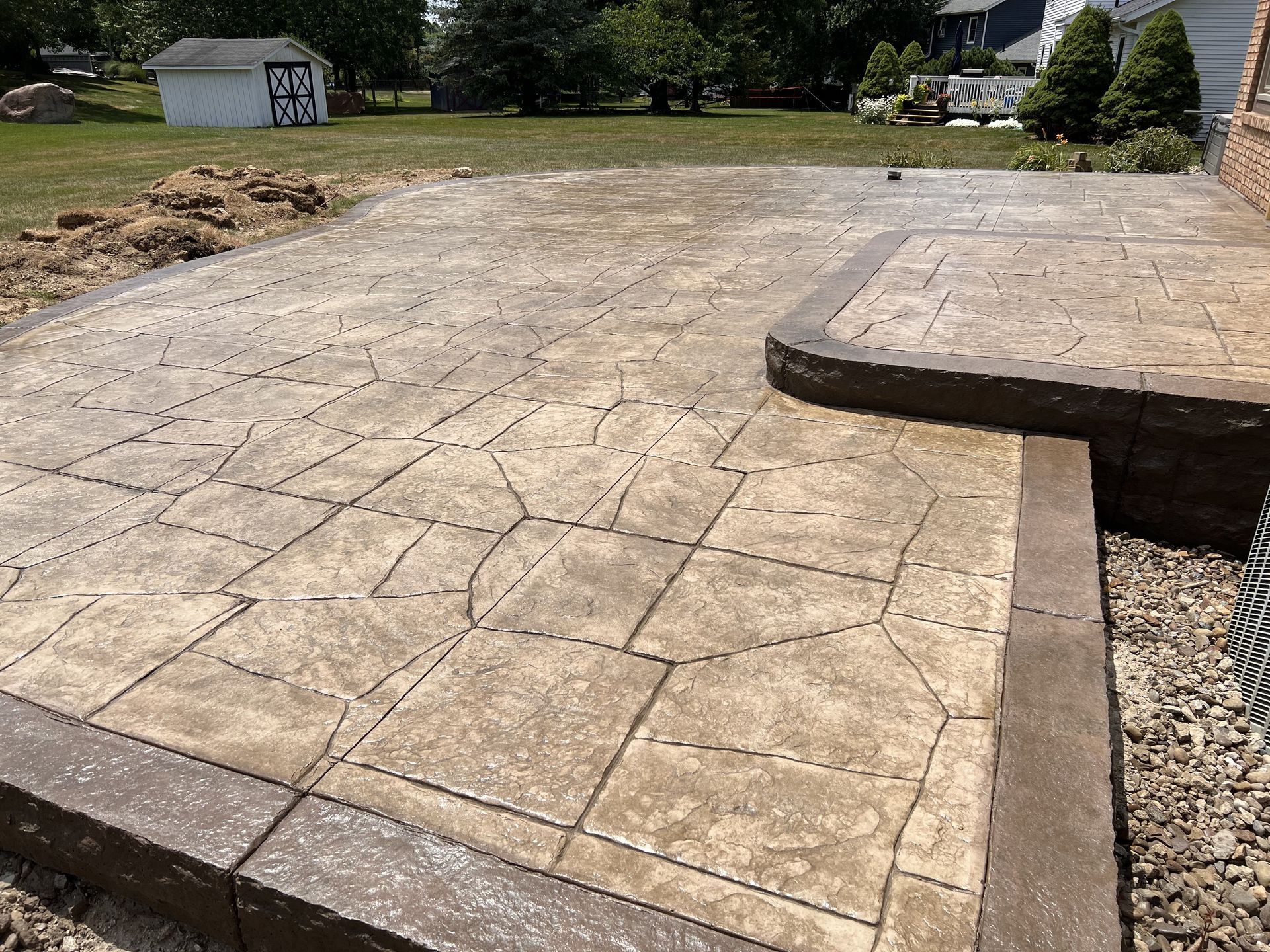 stamped concrete patio with step