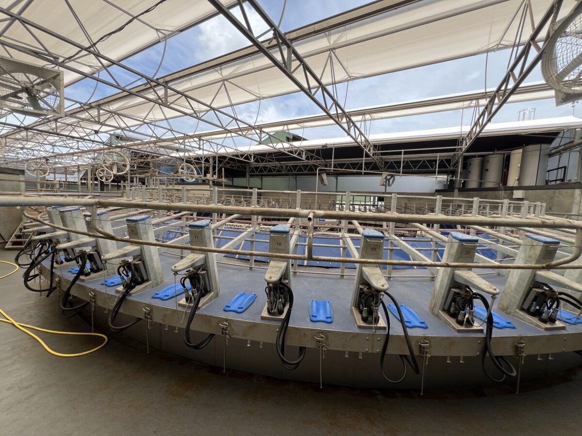 A large circular structure with a fence around it