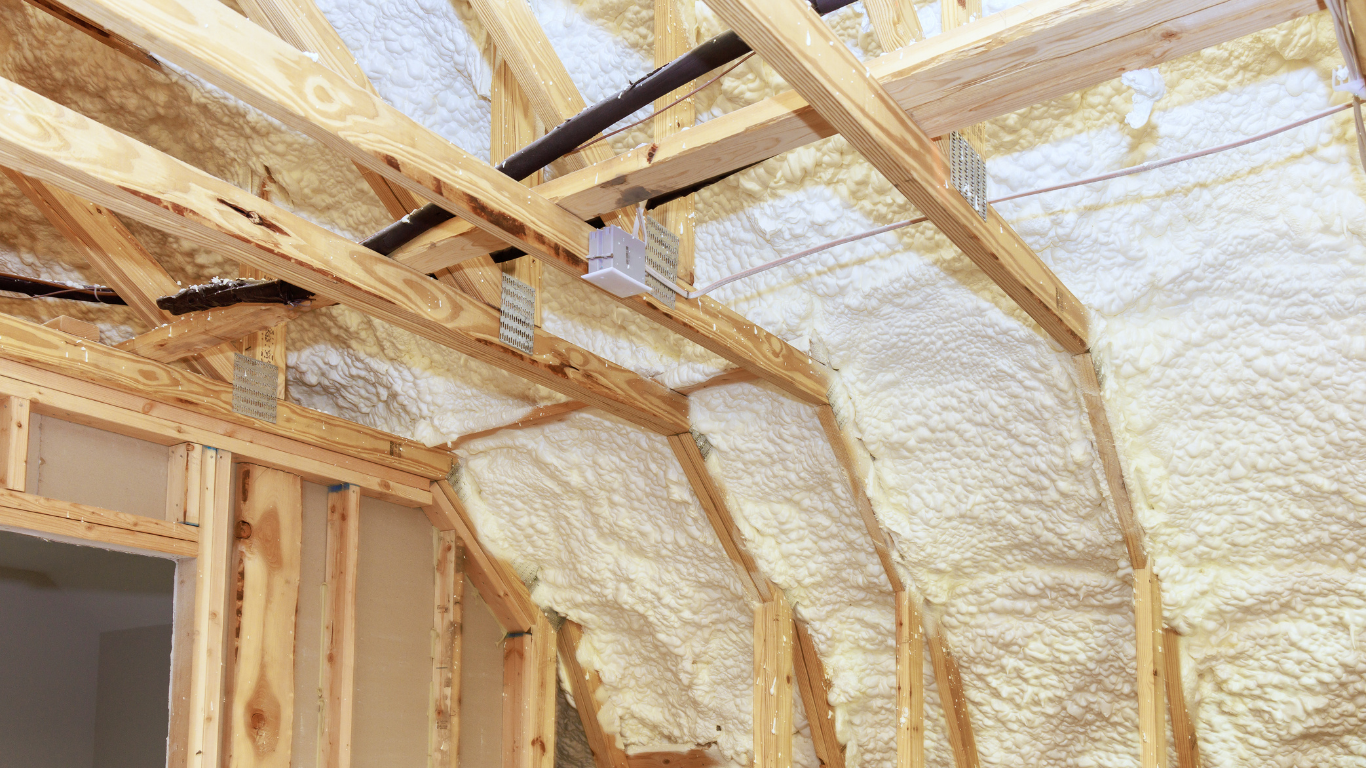 Neatly applied spray foam insulation in an attic, creating an airtight seal for superior energy efficiency and a warm, eco-friendly home in County Limerick.