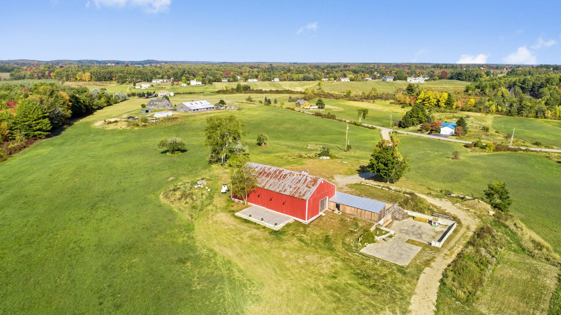 Beautiful aerial view of the barn and open field — Dayton, ME — This Old Barn