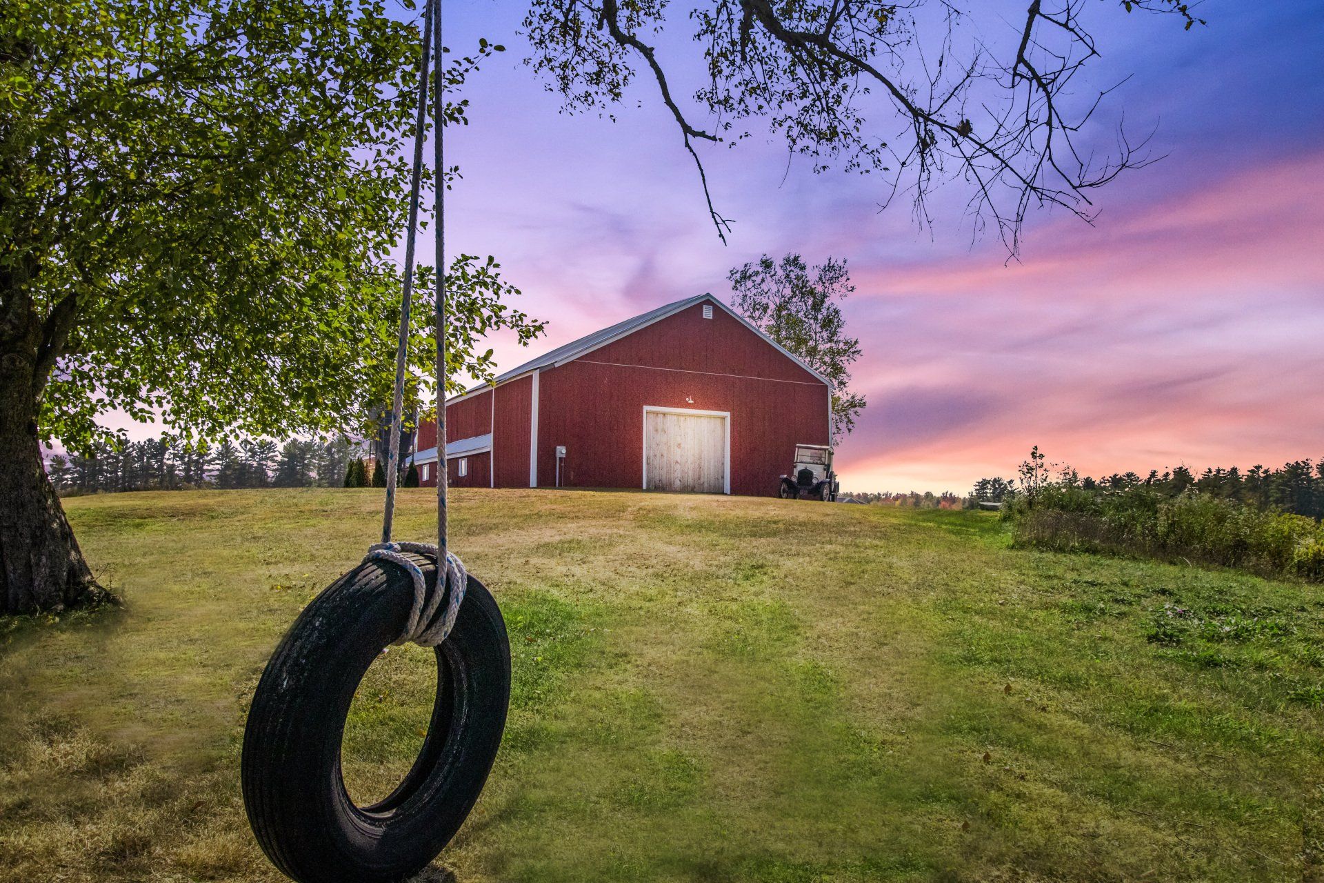 Barn's view during sunset from afar — Dayton, ME — This Old Barn
