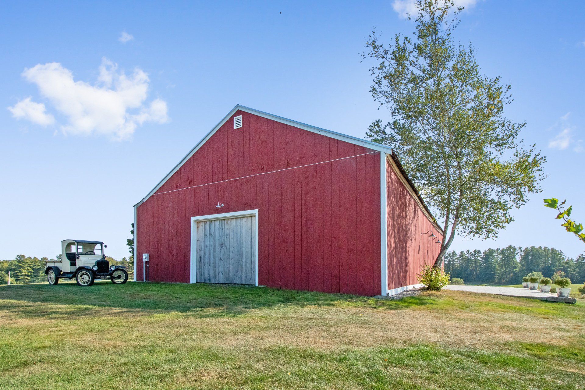 Barn with a classic car on the side — Dayton, ME — This Old Barn