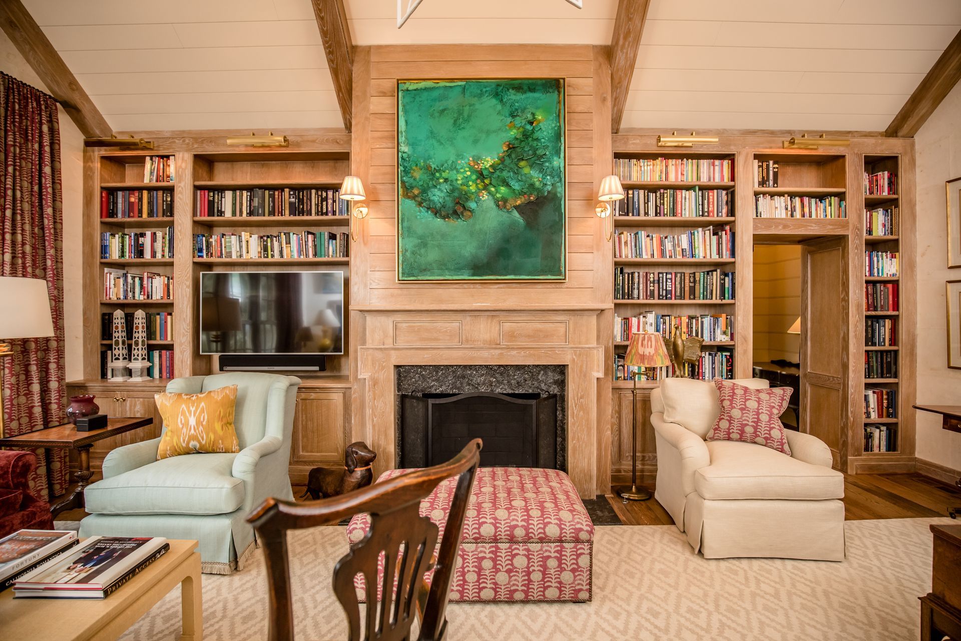 A living room filled with furniture and a fireplace.