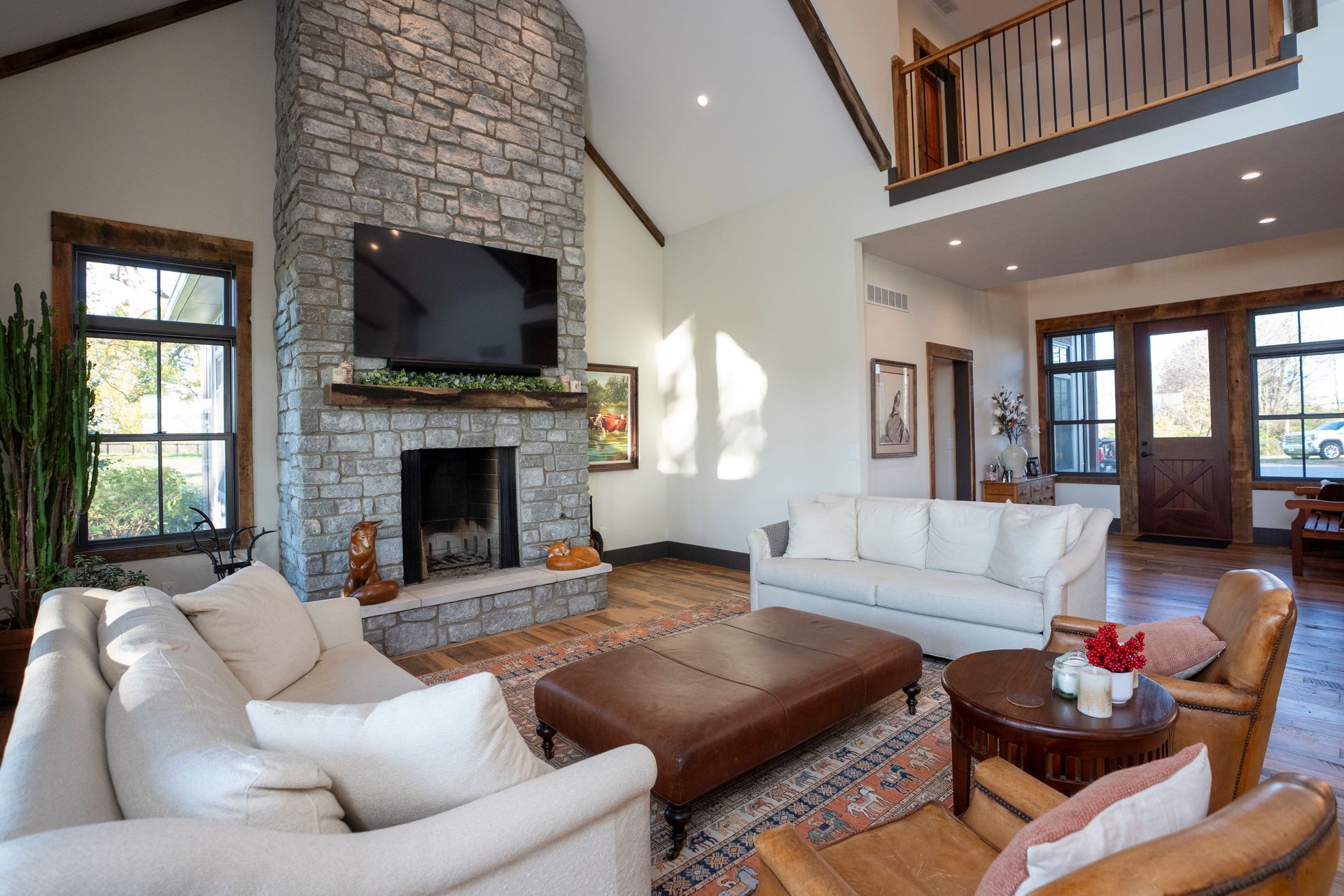 A living room filled with furniture and a fireplace.