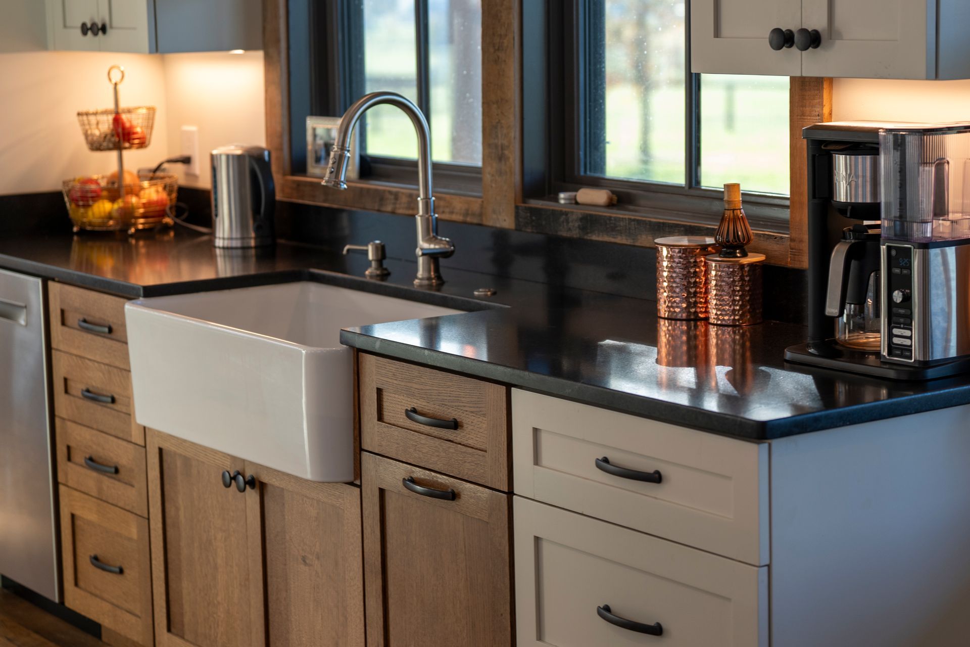 A bathroom with two sinks and two mirrors.