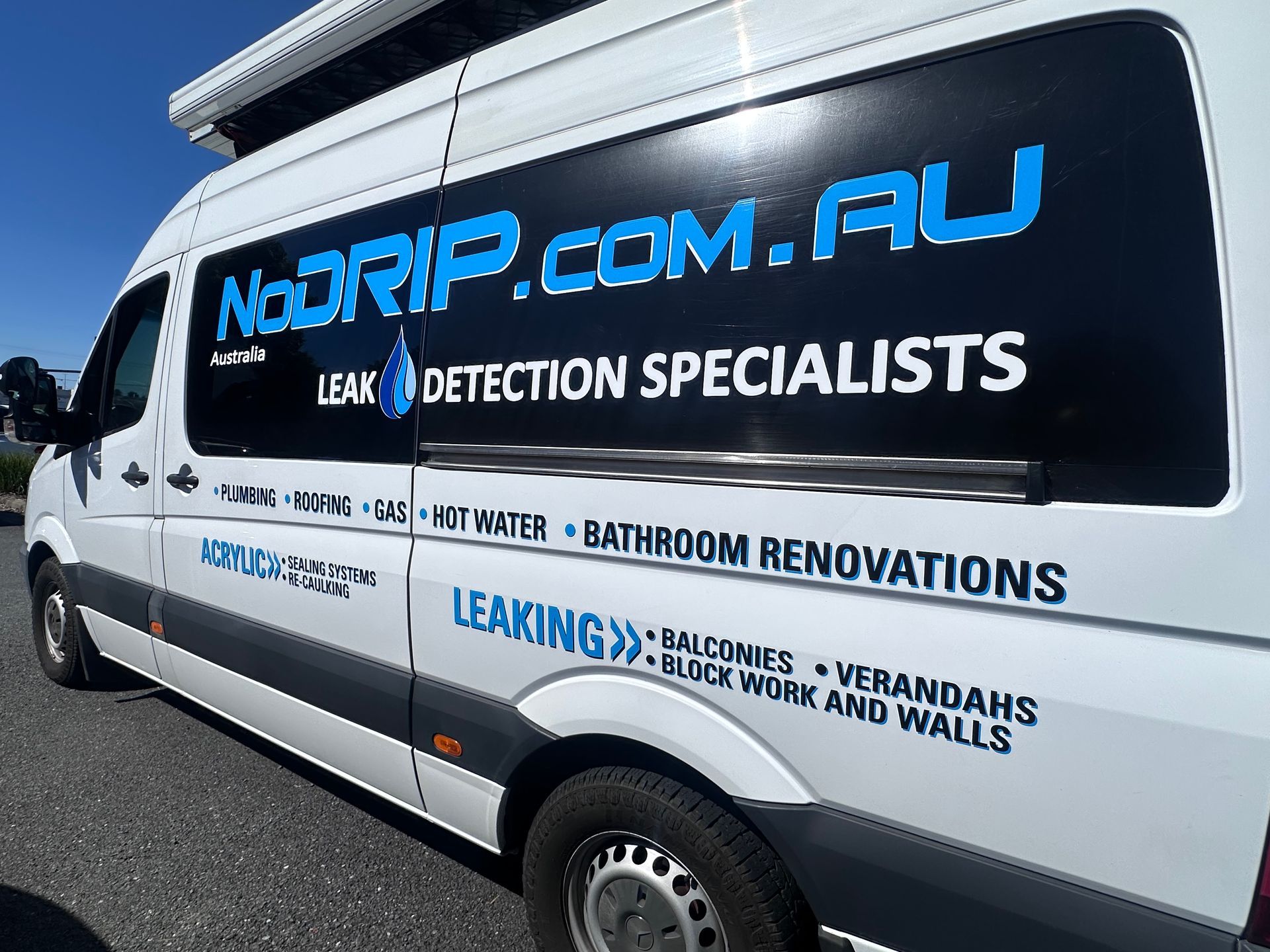White van with large blue NoRIP.com.au leak detection and bathroom renovations branding on the side