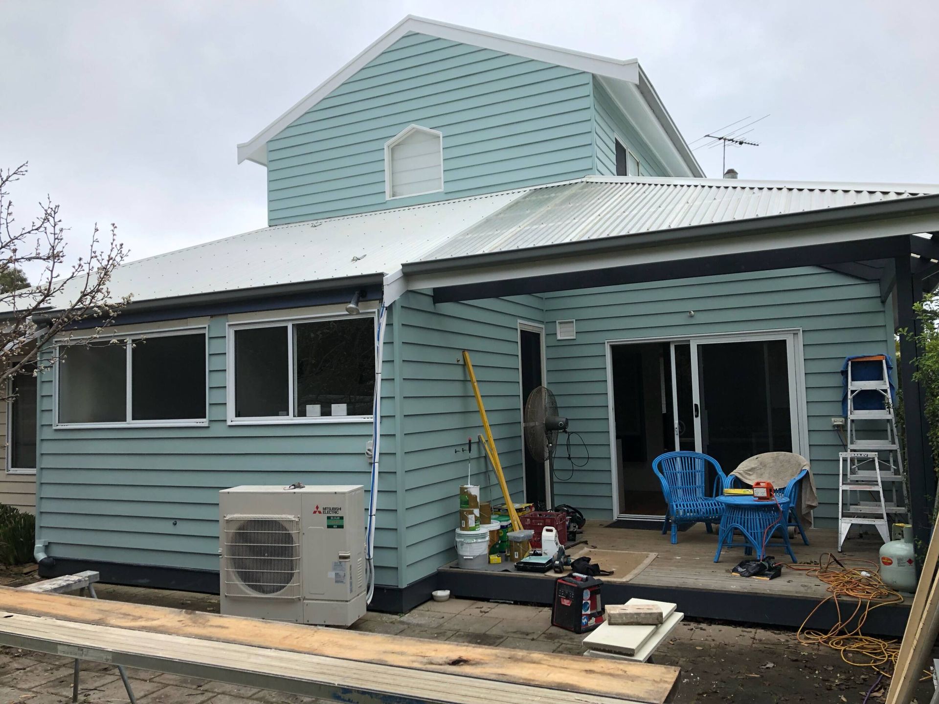 Light Blue House Exterior with Patio  — NoDrip Plumbing & Roofing In Port Macquarie, NSW