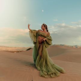 A woman in a bikini is holding fire in her hands.