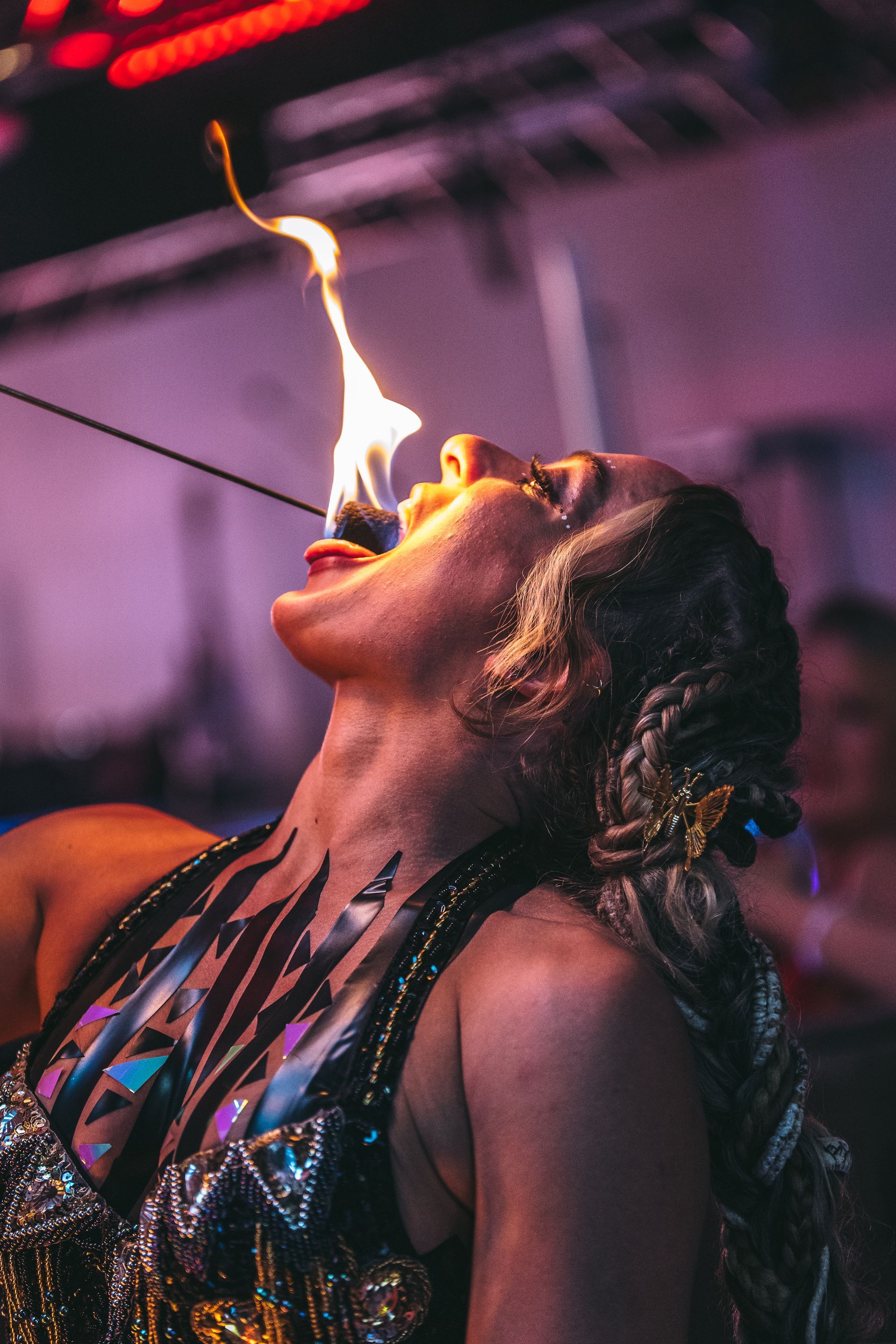 A woman eating fire.
