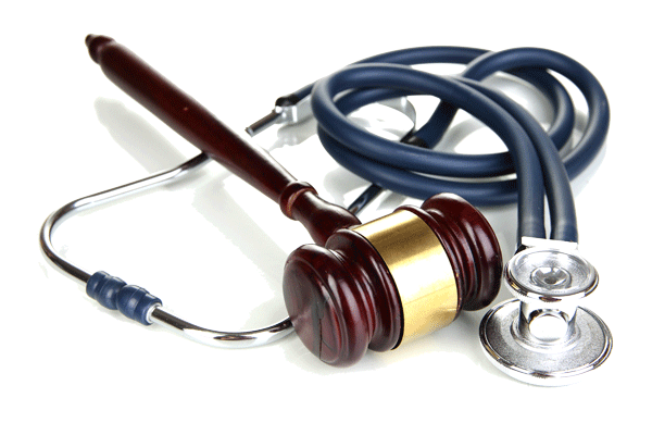 A judge 's gavel and stethoscope on a white background