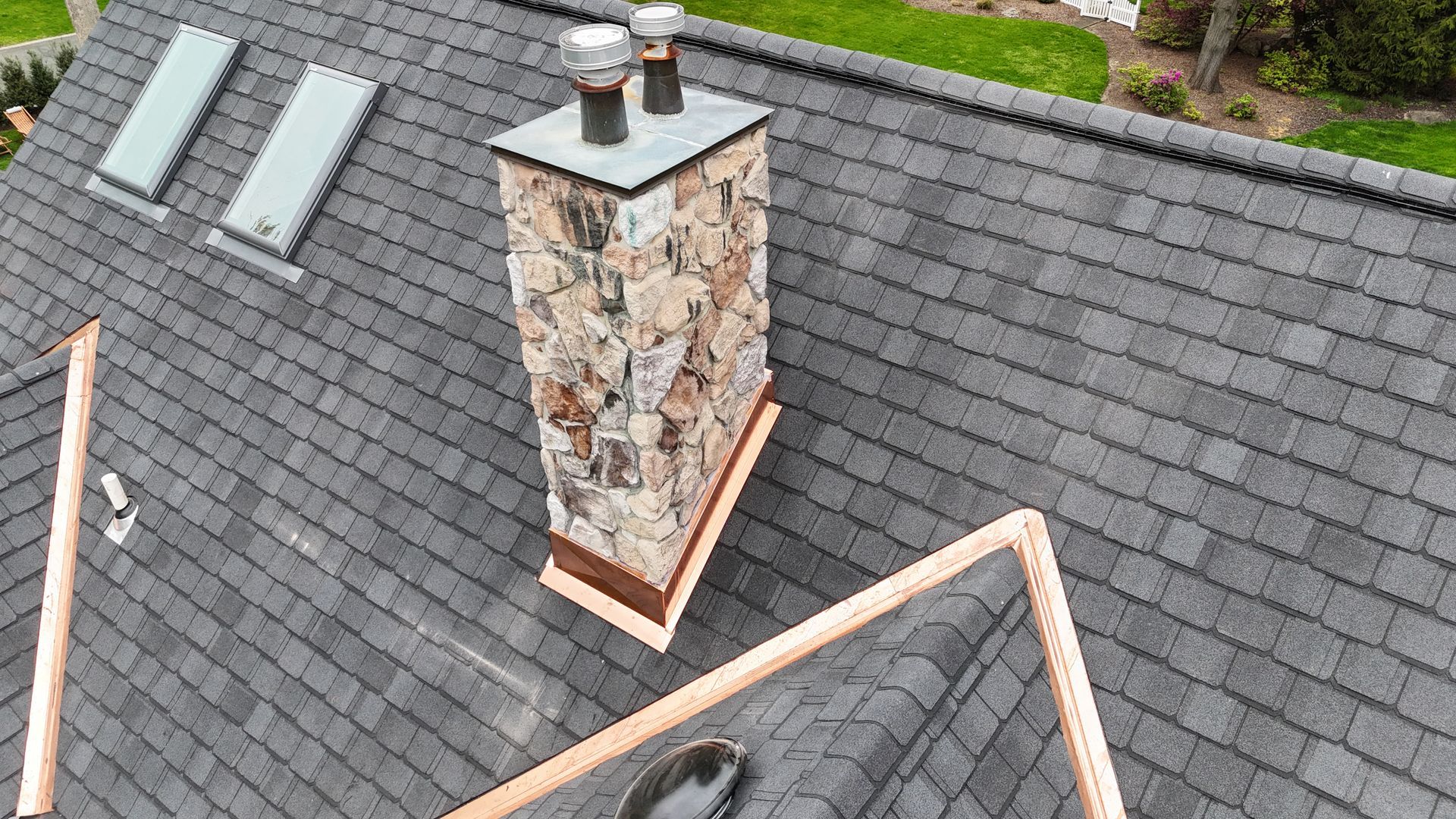 Cooper Chimney flashing on a new Atlas Shingle Roof. With 2 new skylights.