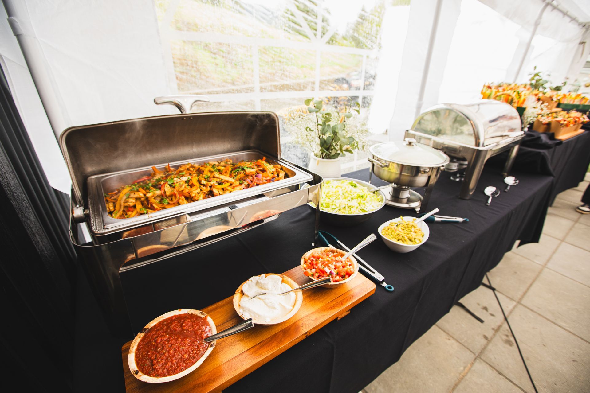 A buffet table with a bunch of food on it.