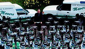  The owner of Alex McDougall (Mowers) Ltd surrounded by mowers