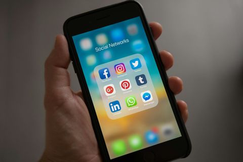 Social media content for local businesses on phone screen
