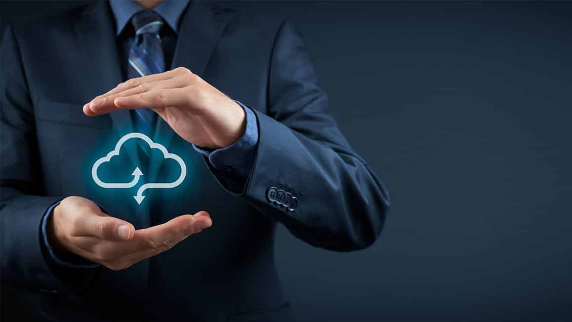 Business men with cloud backup icon between his hands