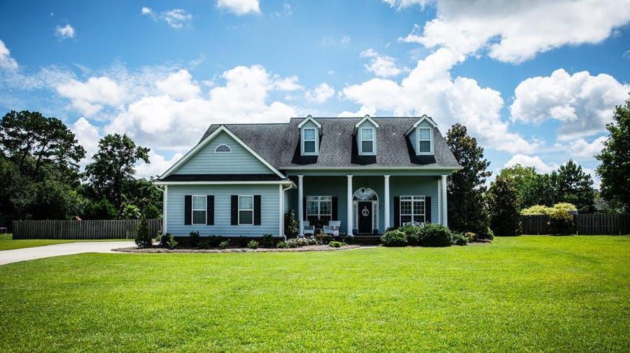 sunny front of home with insurance coverage