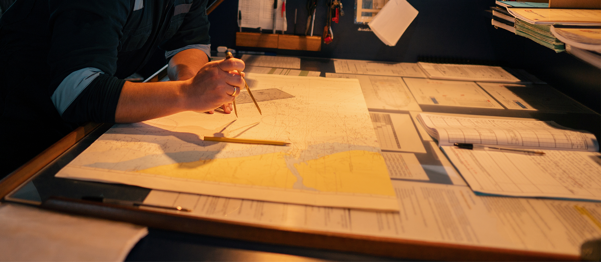 Dark storm clouds over the ocean, possibly rain in the distance. View from inside a boat.