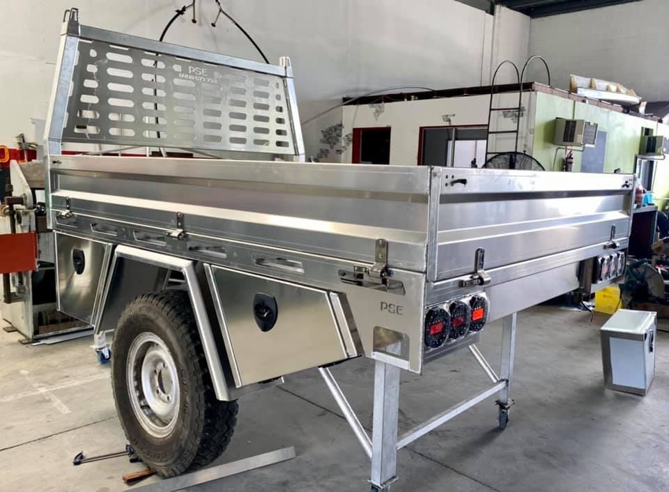 A Stainless Steel Trailer Is Sitting in A Warehouse — PSE Stainless Steel Fabrications in Manunda, QLD