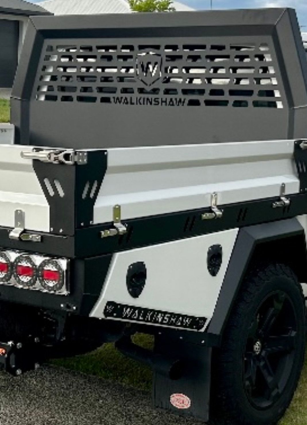 A white and black truck is parked on the side of the road  — PSE Stainless Steel Fabrications in Manunda, QLD