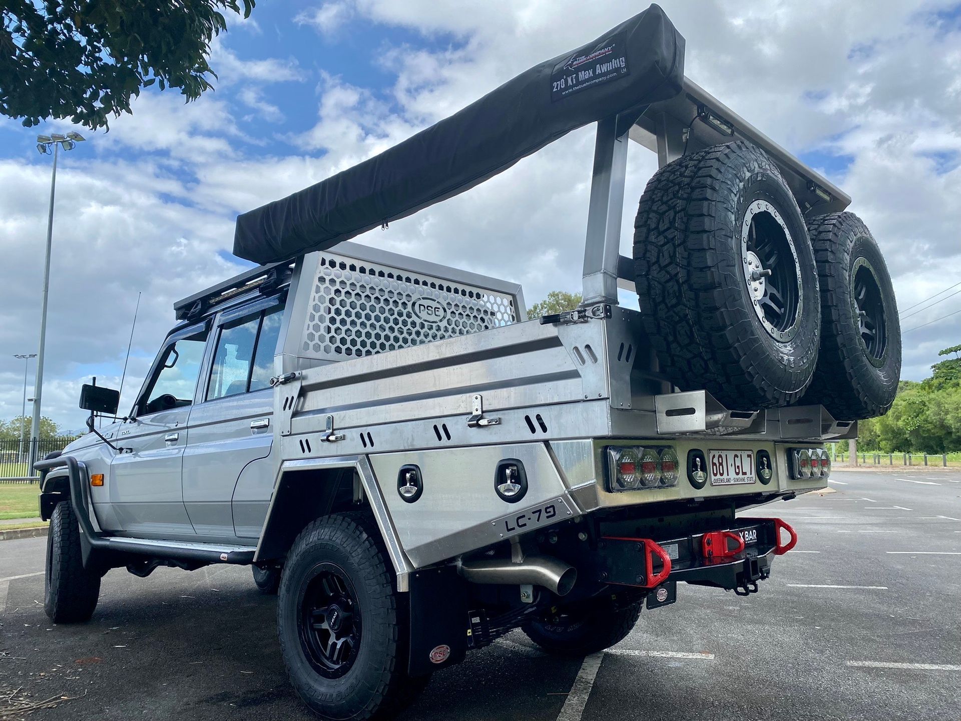A silver truck with a tray on the back is parked in a parking lot  — PSE Stainless Steel Fabrications in Manunda, QLD