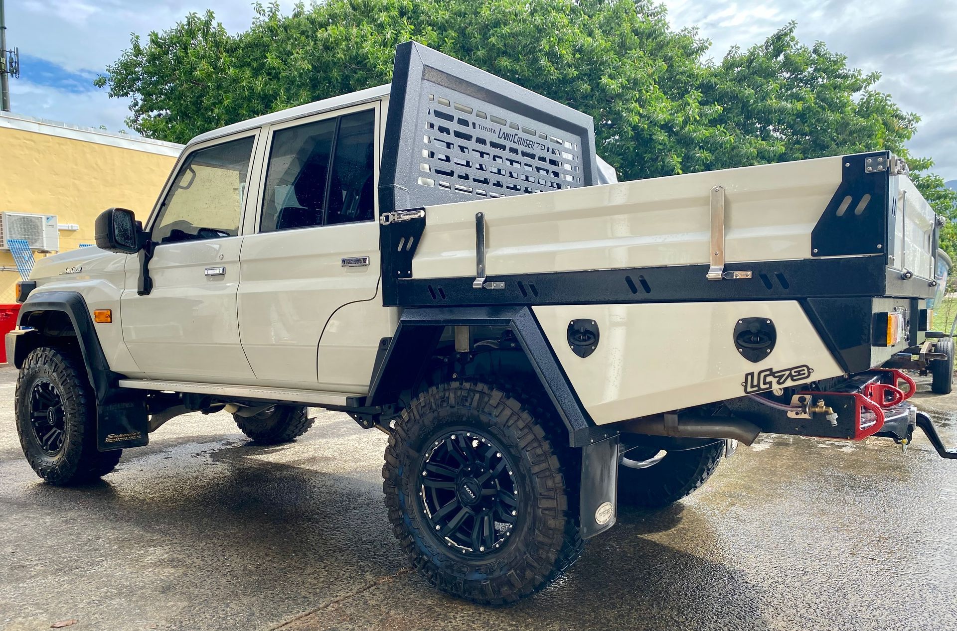 A Silver Truck with A Black Box on The Back Is Parked on The Side of The Road — PSE Stainless Steel Fabrications in Manunda, QLD