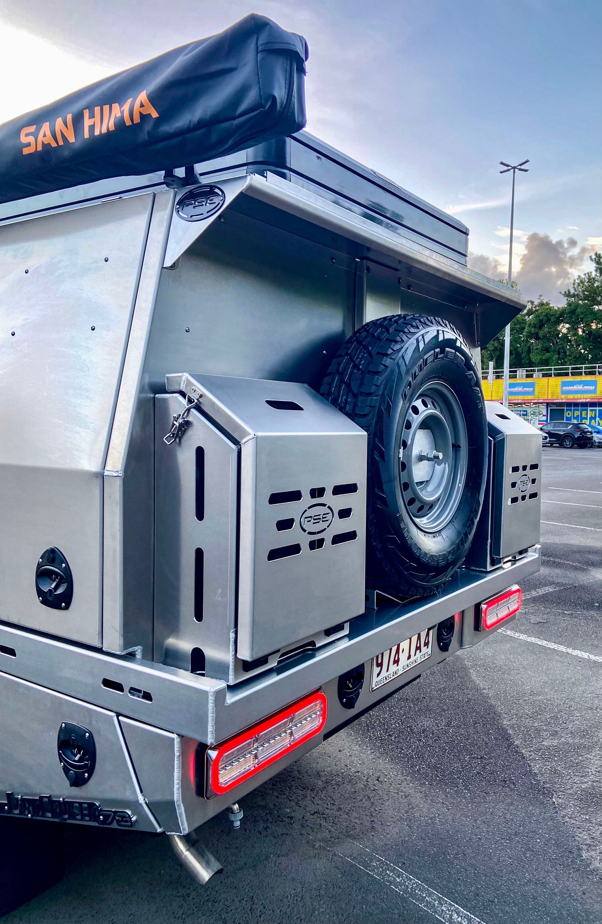 A White Truck with A Canopy Is Parked on The Side of The Road — PSE Stainless Steel Fabrications in Manunda, QLD