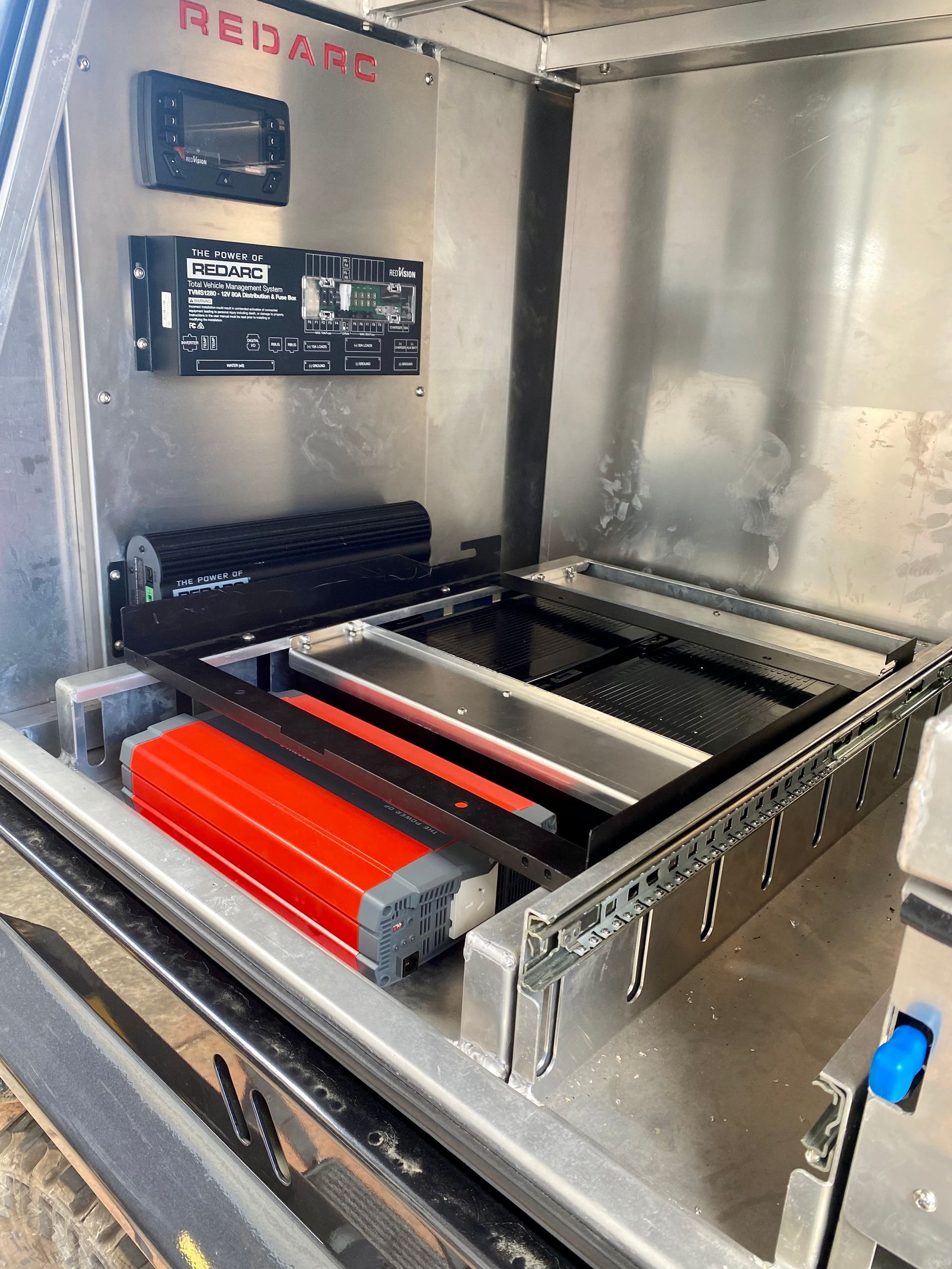 A stainless steel cabinet with a red box in it  — PSE Stainless Steel Fabrications in Manunda, QLD