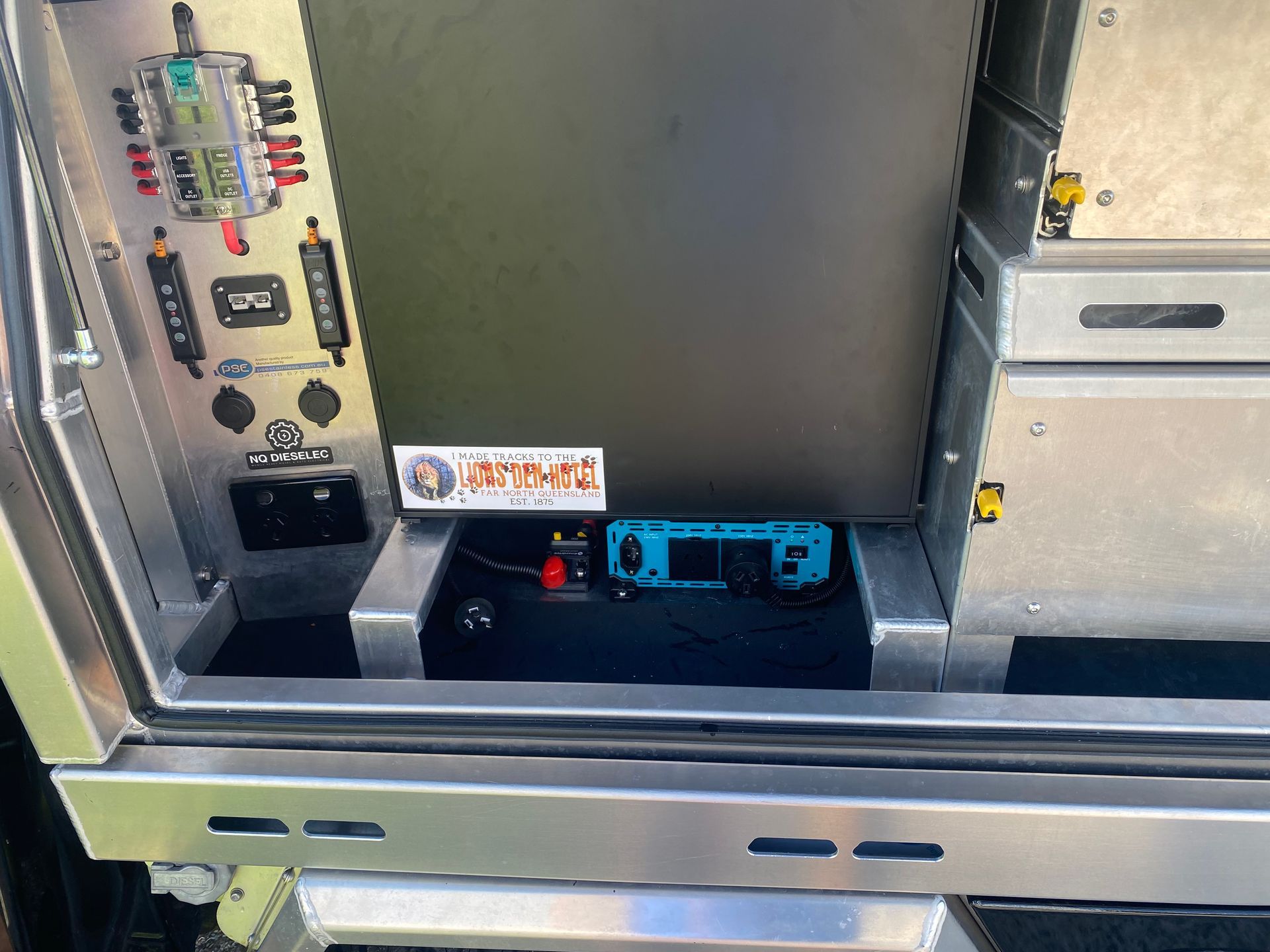 A stainless steel cabinet with a sticker on it that says ' stainless steel ' on it  — PSE Stainless Steel Fabrications in Manunda, QLD