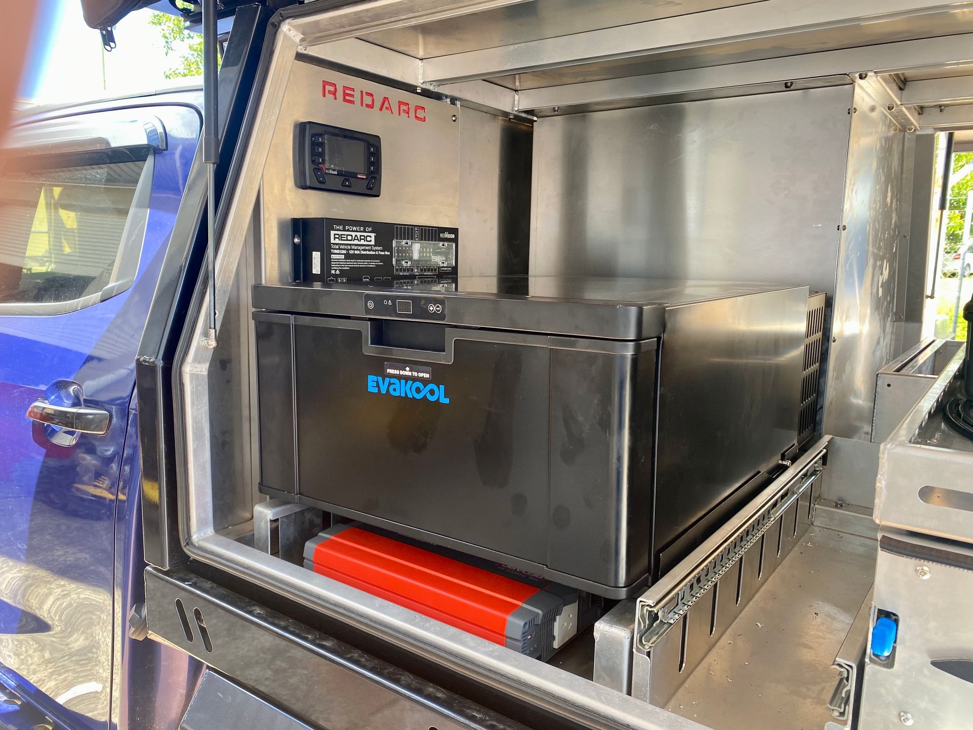 A refrigerator is sitting in the back of a truck  — PSE Stainless Steel Fabrications in Manunda, QLD