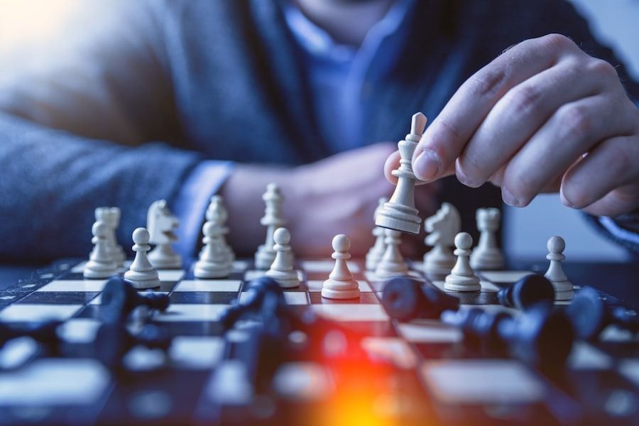 A man is playing a game of chess on a chess board.