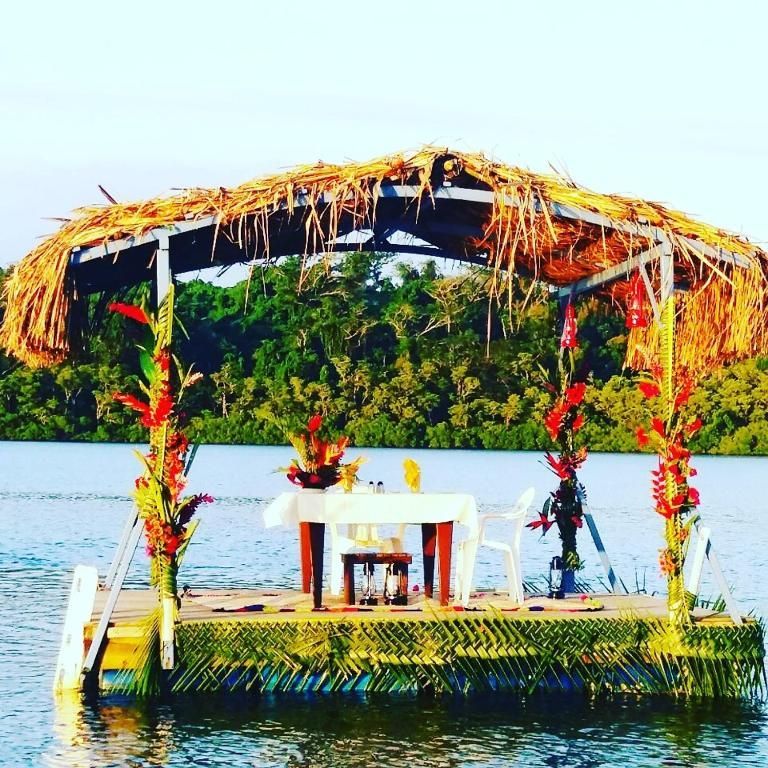 A floating platform with a table and chairs on it