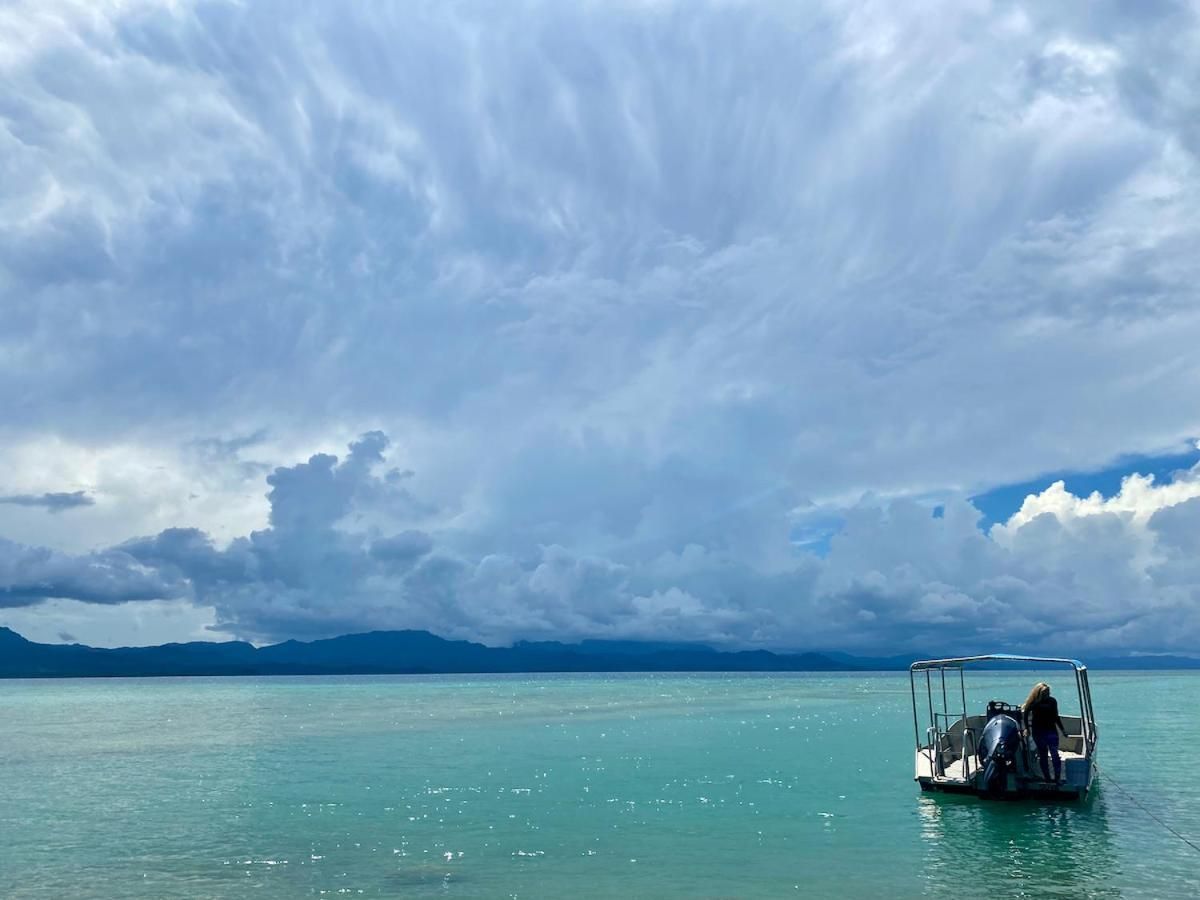 A boat is floating on top of a body of water.