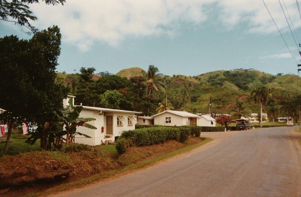A row of houses on the side of a road