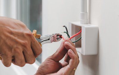 electrician working on wires - Electrician Brisbane - DB Electrical