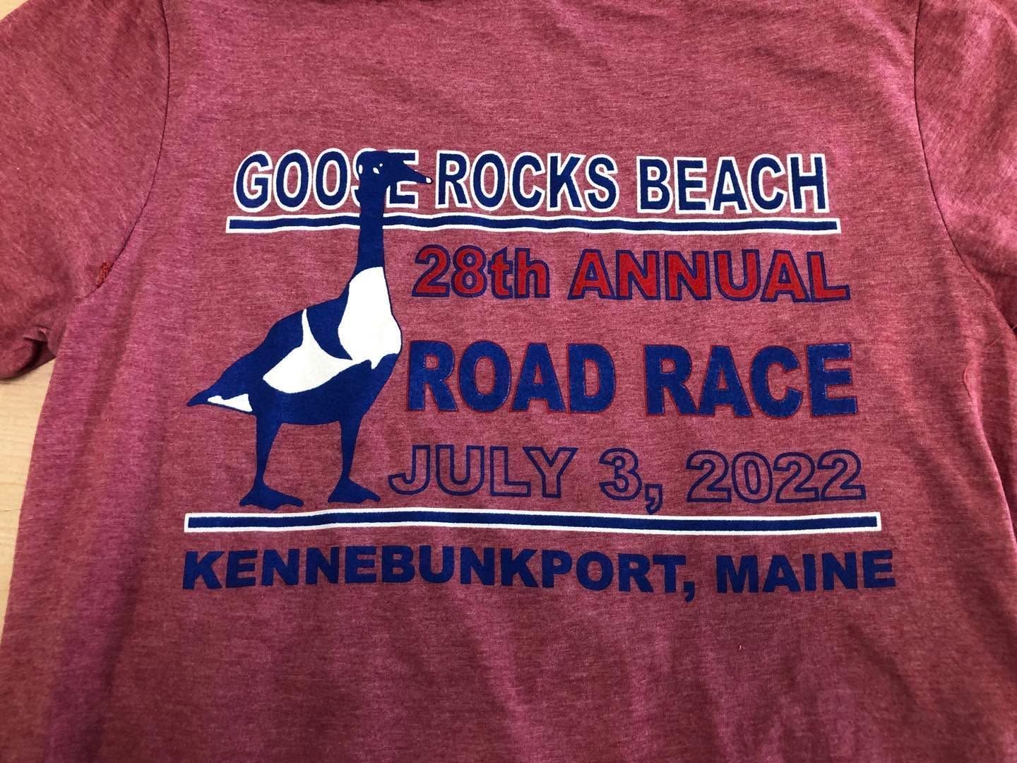 Red t-shirt with blue text and goose graphic. 