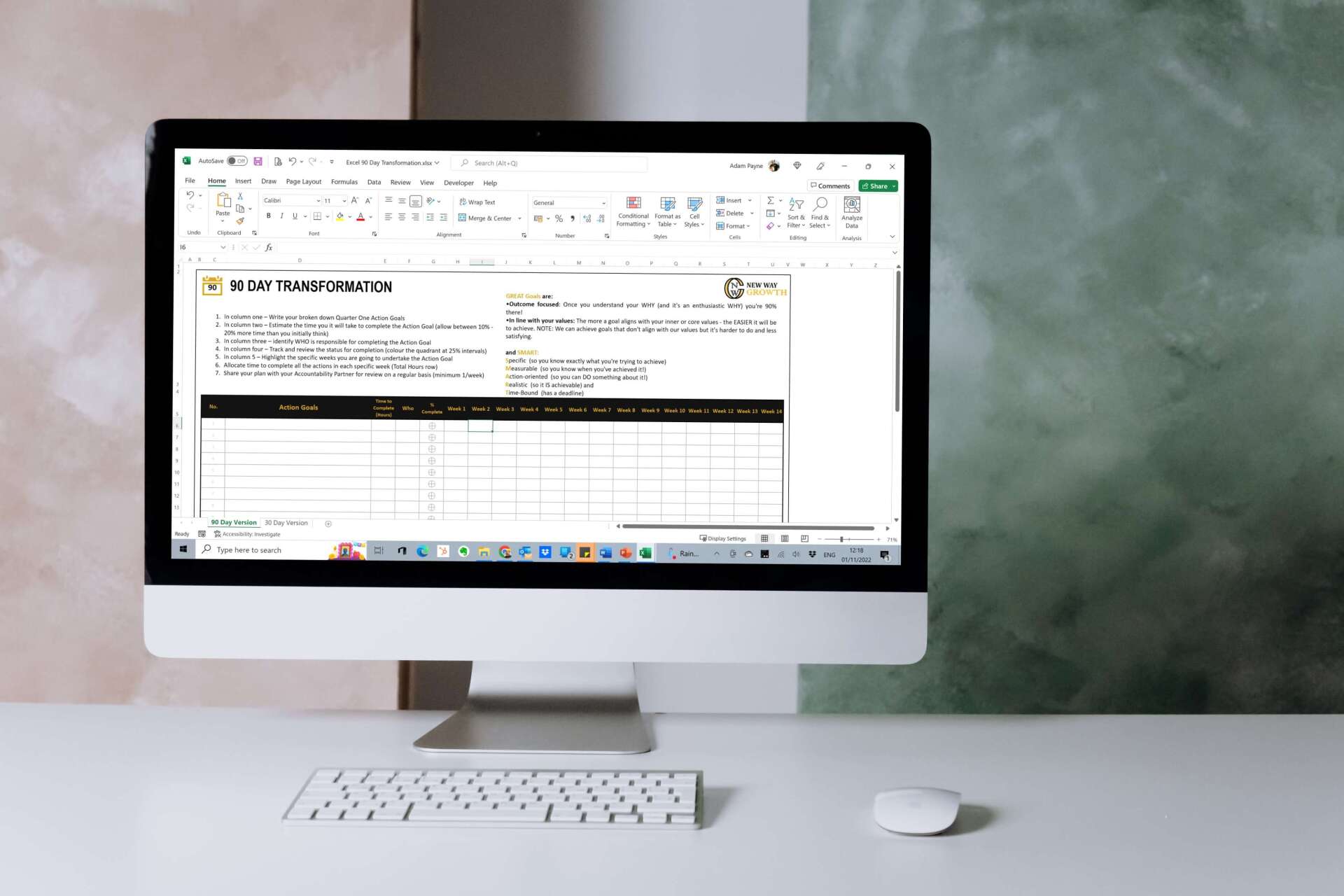 Computer monitor on desk displaying 90 day action plan template