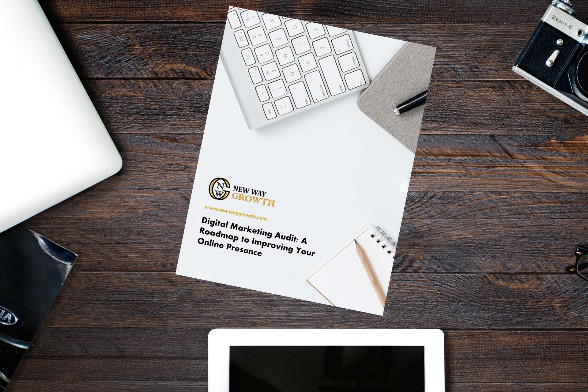 stationary, desktop computer with digital marketing audit on desk