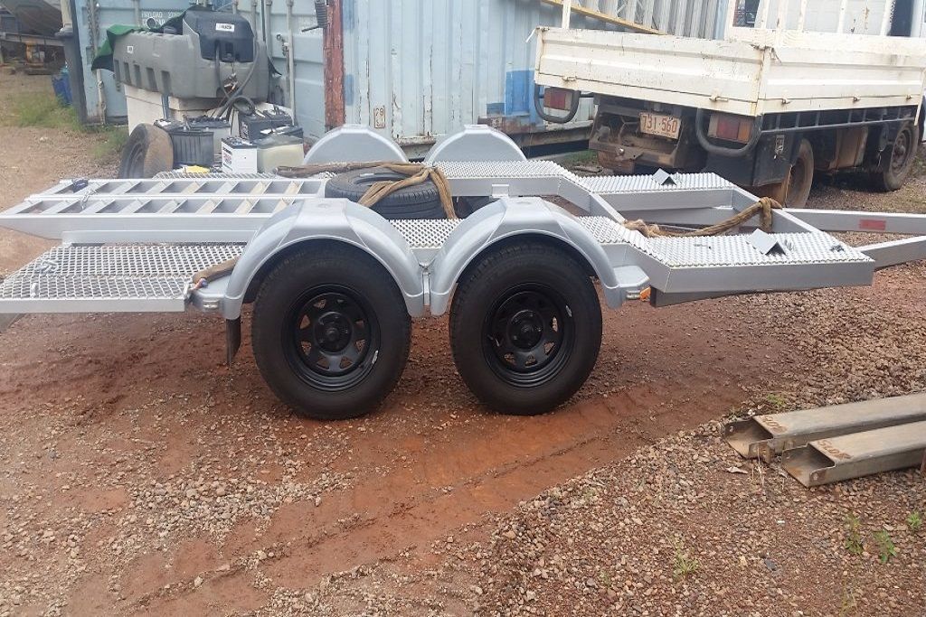 A Trailer is Parked in a Gravel Lot Next to a Truck — Preston’s NT in Winnellie, NT