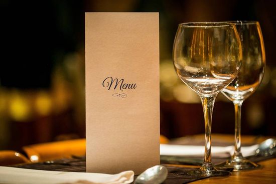 wine glass and restaurant menu