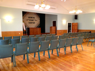 A room with rows of chairs and a sign that says general point center