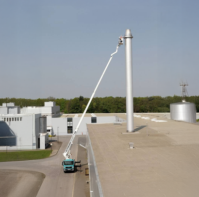 A crane is attached to the side of a building